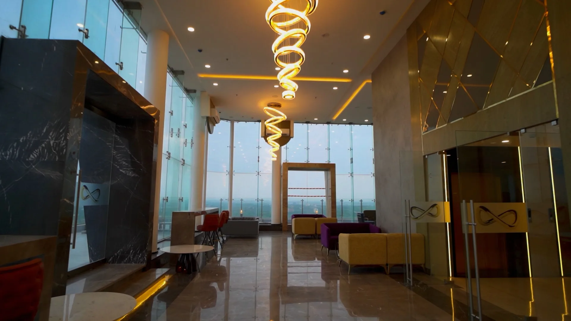 The finished lounge interior at Kukreja Infinity, imported stone and fittings